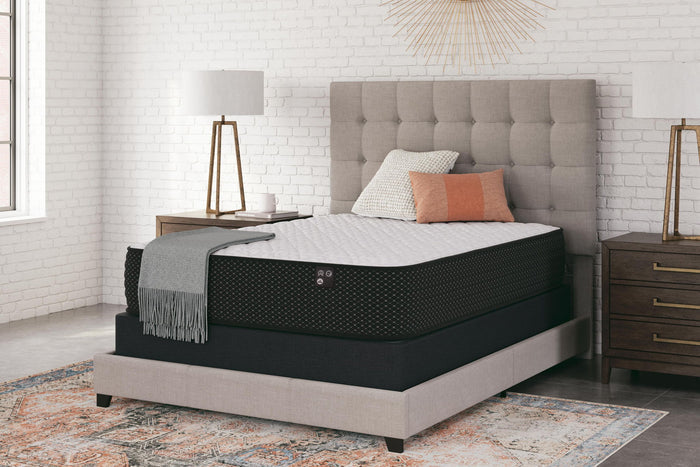 Limited Edition Firm innerspring mattress in black on beige bed frame with gray tufted headboard - Bel Furniture