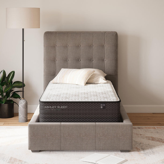 Ashley Sleep Limited Edition Plush innerspring mattress on gray upholstered bed frame in modern bedroom